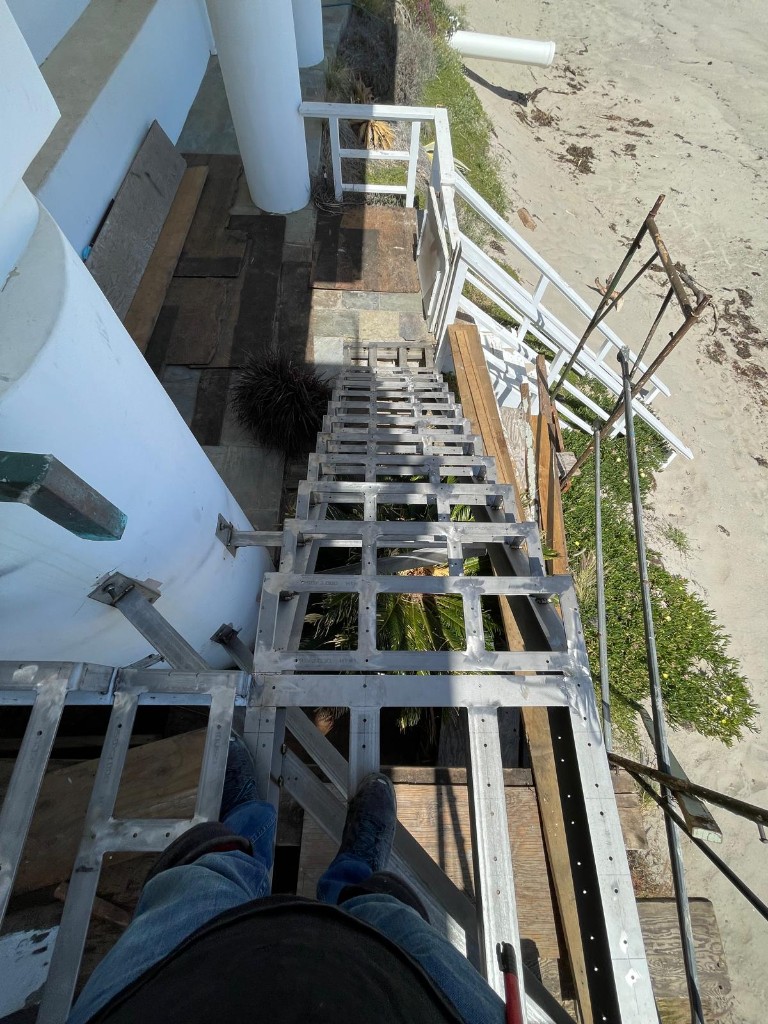 Looking down a commercial steel stair frame during installation