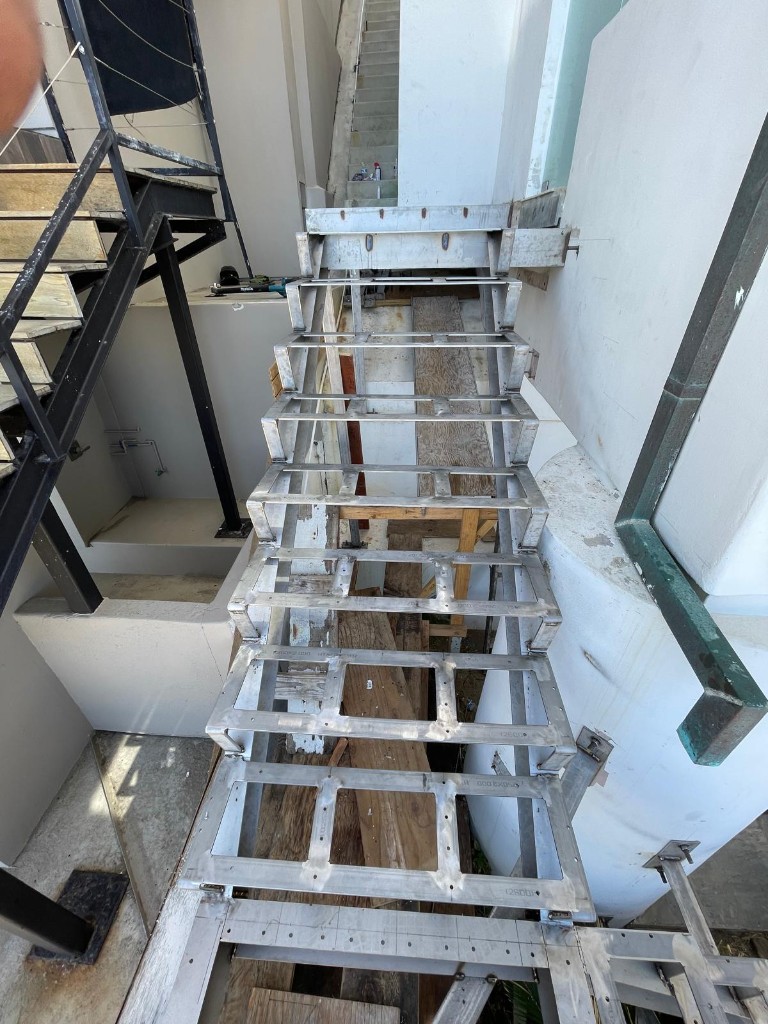 Overhead view of a commercial steel stair frame under construction